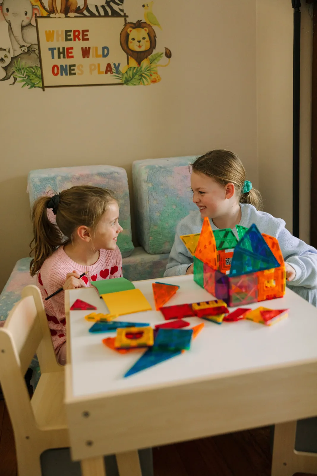 Two sisters playing in the A Sound Image kids' corner
